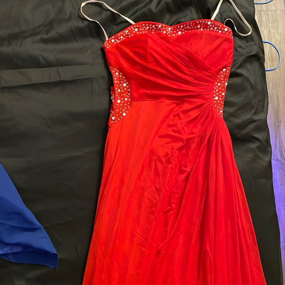 Red bedazzled gown. Size extra small. For a small waistband length shortened